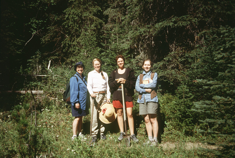Four women with gardening supplies